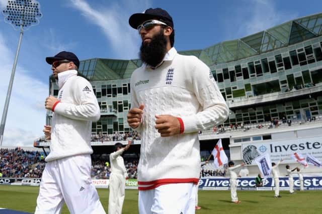 James Anderson and Moeen Ali of England head on to the field at Headingley. Picture: Getty Images