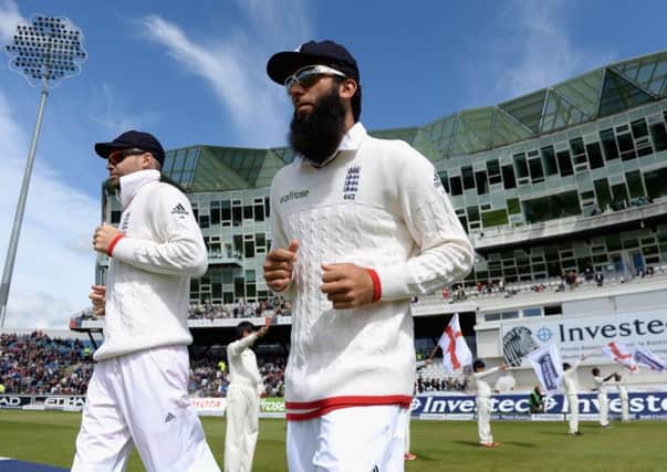James Anderson and Moeen Ali of England head on to the field at Headingley. Picture: Getty Images