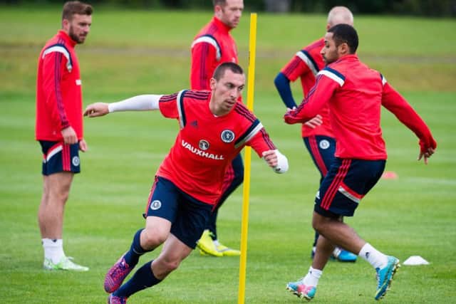 Scotlands Scott Brown, front, is put through his paces ahead of tonights friendly fixture with Qatar. Picture: Rob Casey/SNS