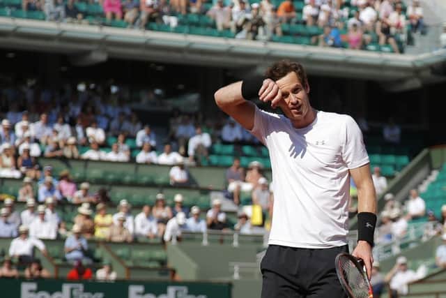 Andy Murray wipes his forehead as he plays Serbia's Novak Djokovic during their semi-final match of the French Open. Picture: AP