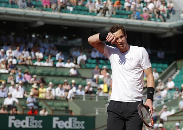 Andy Murray wipes his forehead as he plays Serbia's Novak Djokovic during their semi-final match of the French Open. Picture: AP