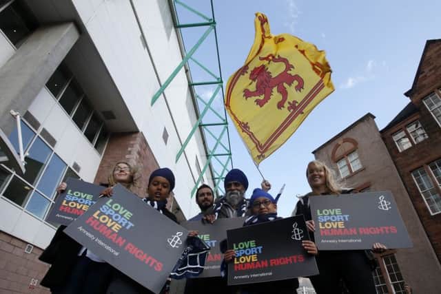 Protesters gather outside Easter Road prior to last nights international friendly to highlight human rights abuses suffered by migrant workers in Qatar as the country prepares for the 2022 World Cup Picture: PA