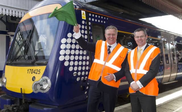 Jeff Hoogesteger, left, the former CEO of Abellio Group, with Transport Minister Derek Mackay MSP on
1 April 2015. Picture: Jane Barlow