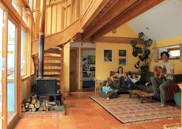 Forest designer Alex Glasgow, his partner Kyla Orr and his children nine-year-old Ash and seven-year-old Poppy in and around their eco-friendly home in Plockton. Picture: Contributed