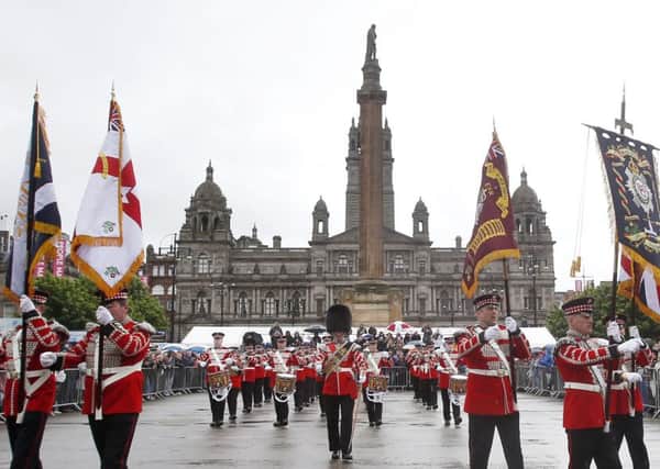 The Black Skull flute band perform in George Square, Glasgow, during Orangefest. Picture: PA