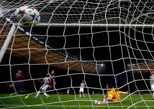 Luis Suarez scores Barcas second and, ultimately, decisive goal. Photograph: Getty