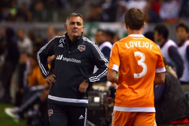 Owen Coyle, currently head coach with Houston Dynamo, talks to player Rob Lovejoy. Picture: Getty