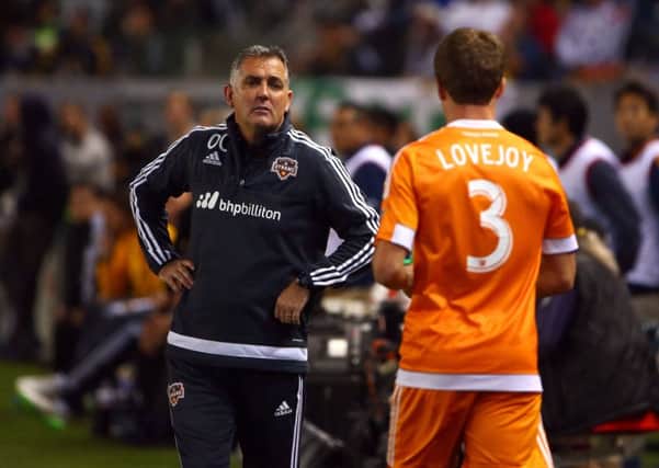 Owen Coyle, currently head coach with Houston Dynamo, talks to player Rob Lovejoy. Picture: Getty