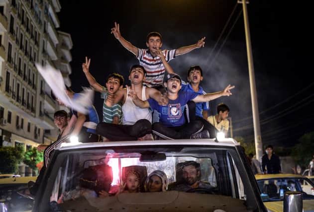 HDP supporters, top, celebrate its success. Picture: Getty