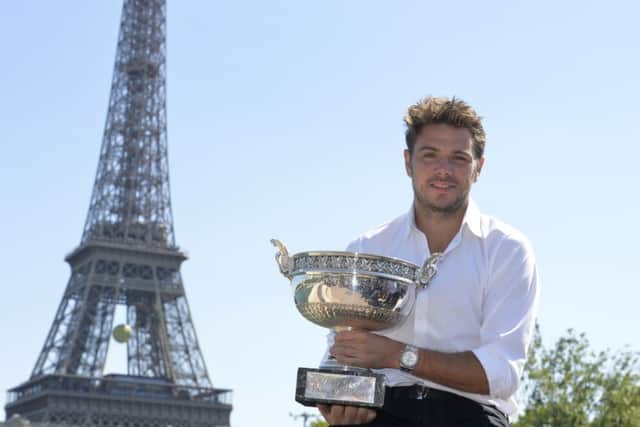 French Open winner Stan Wawrinka poses with the Musketeers Trophy. Picture: Getty