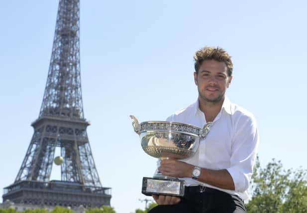 French Open winner Stan Wawrinka poses with the Musketeers Trophy. Picture: Getty