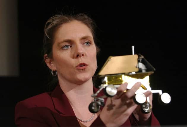 On this day in 2003 the Spirit Rover was launched for Mars. Mission manager Jennifer Trosper displays model of the lander. Picture: Getty