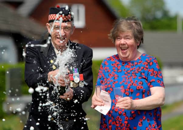 Former soldier Geordie and wife Betty Rhodick, from Lochgilphead, celebrate their winnings. Picture: Hemedia