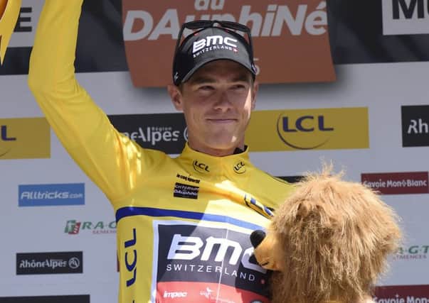 Rohan Dennis celebrates taking the leader's yellow jersey at the Criterium du Dauphine. Picture: AFP/Getty