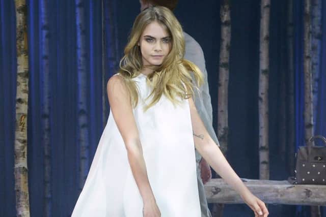 Model Cara Delevingne poses at a photocall to launch the Mulberry Cara Delevingne Collection during London Fashion Week. Picture: Getty