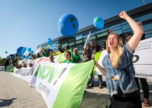 Demonstrators from environmental campaign group Friends of the Earth demand global action. Picture: Contributed