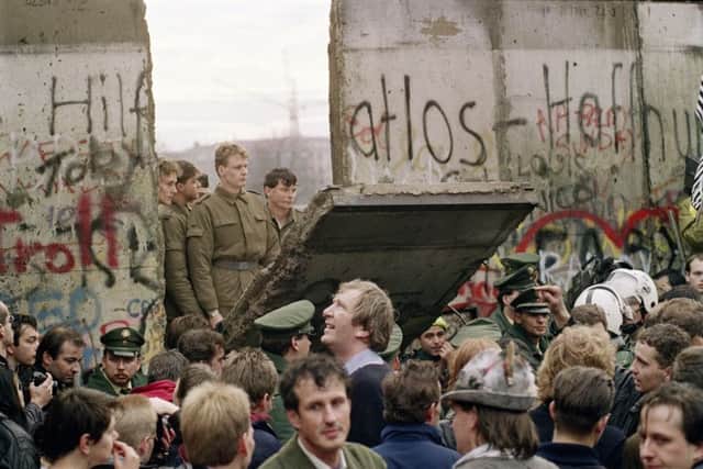 On this day in 1990, the official demolition of the Berlin Wall commenced, a symbol of the collapse of the Soviet Union. Picture: Getty