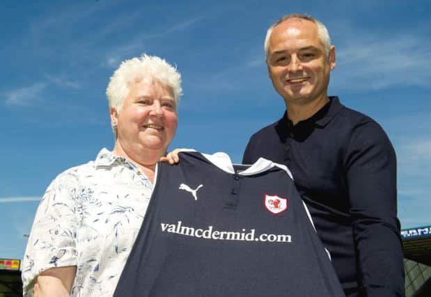 Kit sponsor Val McDermid joins recently-appointed manager Ray McKinnon to unveil Raith Rovers new strip. Picture: SNS