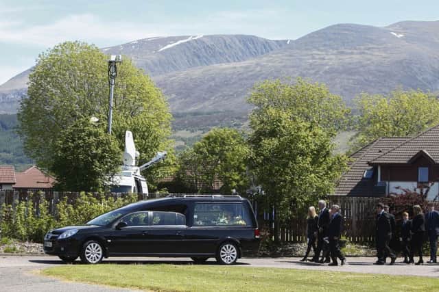 A hearse carrying the coffin. Picture: PA