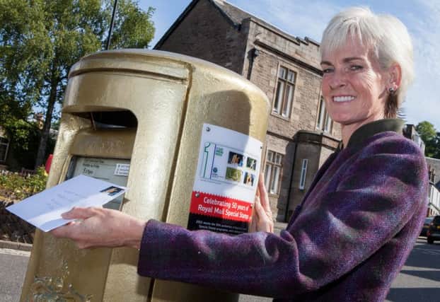 Judy Murray unveils a plaque on the gold postbox in Dunblane. Picture: Hemedia