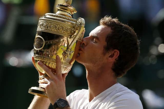 Andy Murray with the Wimbledon trophy after defeating Novak Djokovic in the 2013 final. Picture: PA