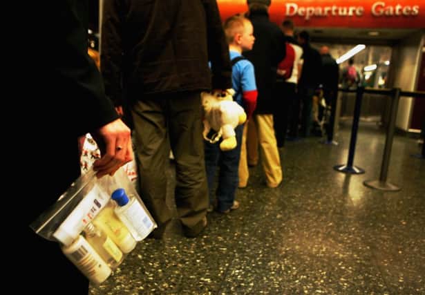 Liquid containers larger than 100ml must go in luggage for the hold or they will be confiscated. Picture: Getty