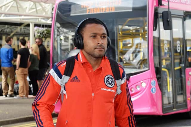 Scotland's Ikechi Anya arrives at Glasgow Airport. Picture: SNS Group