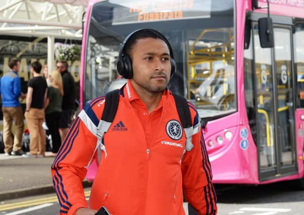 Scotland's Ikechi Anya arrives at Glasgow Airport. Picture: SNS Group