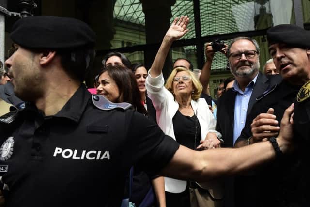Madrids new mayor Manuela Carmena waves to her supporters. Picture: AFP/Getty