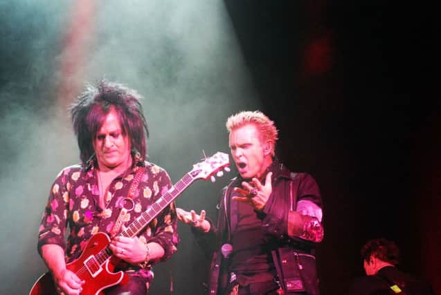 Steve Stevens gives Billy Idol axeman support in a hymn to longevity. Picture: Bethan Hughes