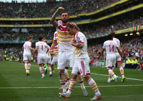 Shaun Maloney celebrates Scotland's goal with Steven Fletcher. Picture: Getty