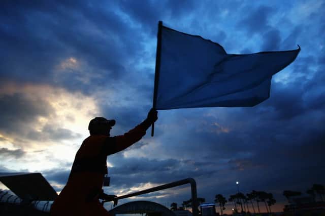 A race marshall at work at sunrise yesterday morning during the second day of the Le Mans 24 Hour race. Picture: Getty