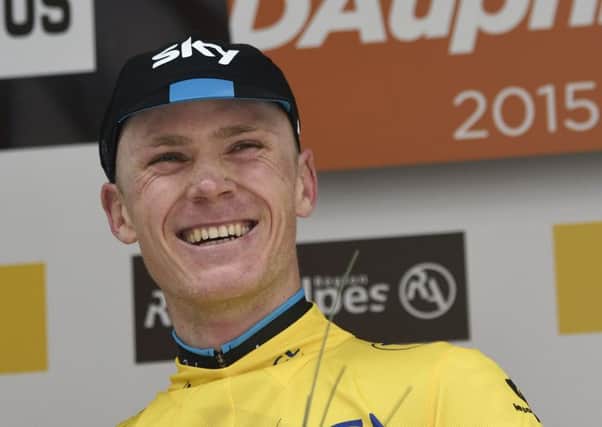 Chris Froome celebrates on the podium at the end of the Criterium du Dauphine. Picture:AFP/Getty