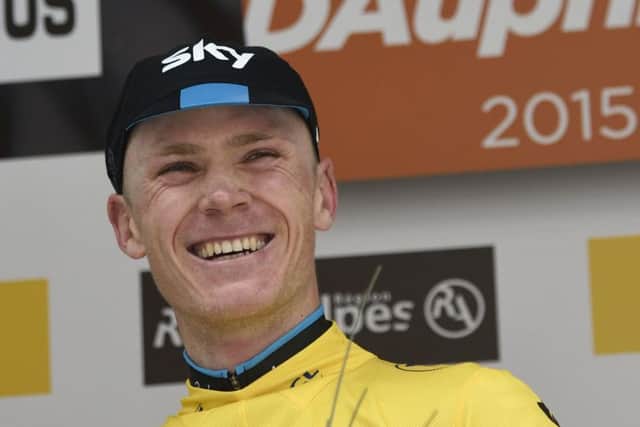 Chris Froome celebrates on the podium at the end of the Criterium du Dauphine. Picture:AFP/Getty