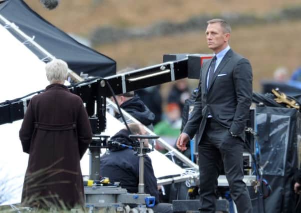 Daniel Craig and Judy Dench filming scenes for Skyfall in the Scottish Highlands. Picture: SWNS