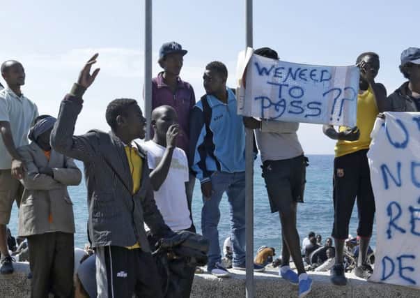 Migrants blocked from moving on demonstrate at the Franco-Italian border this week. Picture: AP