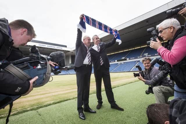Mark Warburton is unveiled at Ibrox yesterday along with his assistant, David Weir. Picture: PA