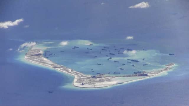 Chinese dredgers at Mischief Reef in the Spratly Islands  or Nansha Islands as China calls them. Picture: US Navy