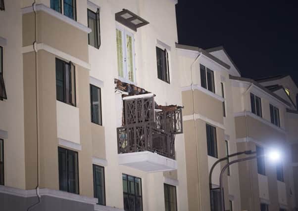 A fourth floor balcony rests on the balcony below after collapsing at the Library Gardens apartment complex in Berkeley, California. Picture: AP