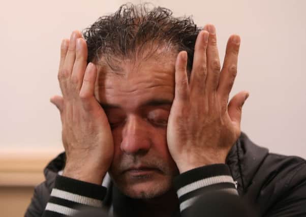 Akhtar Iqbal breaks down at the press conference. Picture: PA
