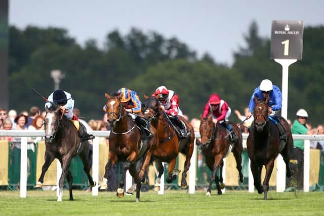 Ryan Moore and Gleneagles, second left, storm to the front in the St Jamess Palace Stakes. Picture: Getty