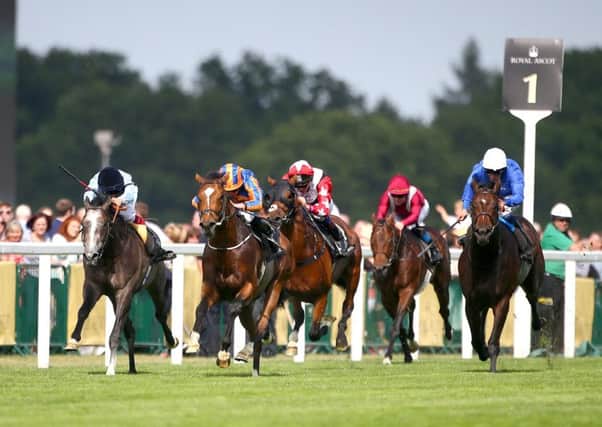 Ryan Moore and Gleneagles, second left, storm to the front in the St Jamess Palace Stakes. Picture: Getty