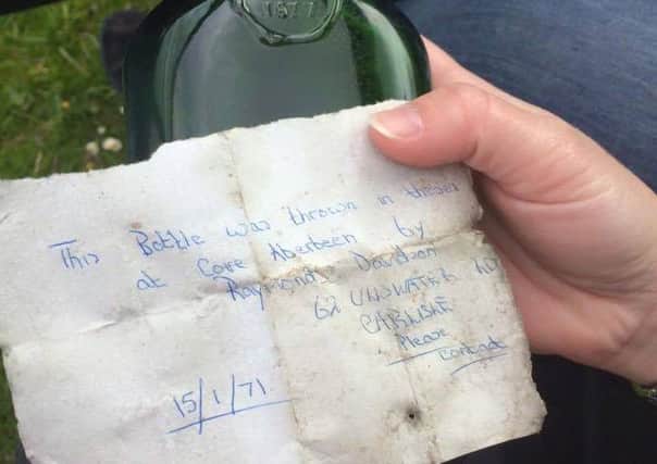 Austrailian couple Sean and Shelley Thomas found the bottle on Rattray Bay, Aberdeenshire. Picture: Facebook
