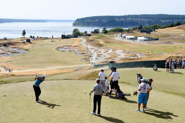 Puget Sound provides a stunning backdrop as defending champion Martin Kaymer hits a tee shot. Picture: Getty