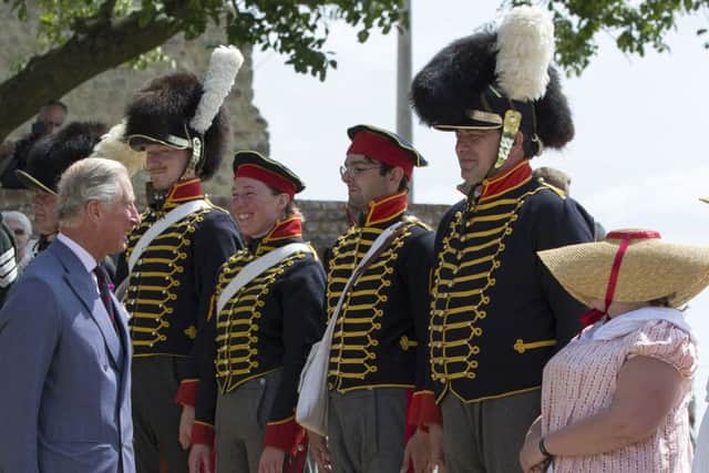 Prince Charles salutes people during a ceremony at the inauguration of the 'Ferme d'Hougoumont' memorial site. Picture: AFP/Getty Images