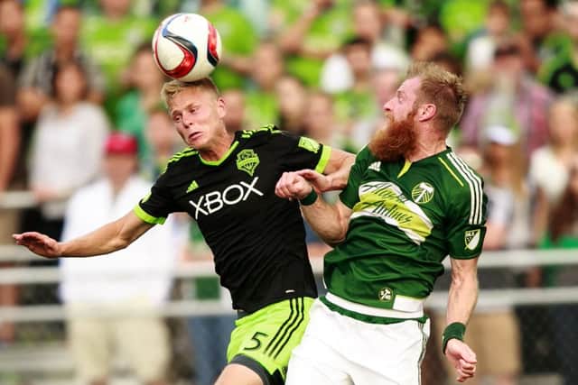 Seattle Sounders midfielder Andy Rose, left, vies with Portland defender Nat Borchers during the illtempered US Open Cup tie. Picture: AP