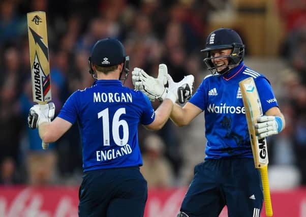 Centurions Eoin Morgan and Joe Root celebrate. Picture: Stu Forster/Getty