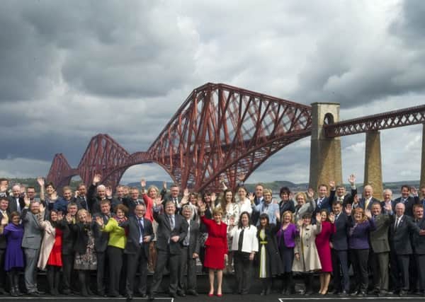 First Minister Nicola Sturgeon joined all 56 newly elected SNP MPs for a photo-call in front of the iconic Forth Bridge at South Queensferry, Edinburgh, Scotland. The SNP won all but three of the 59 General Election seats in Scotland and is now the third largest party in the House of Commons. 9 May 2015. Picture by JANE BARLOW