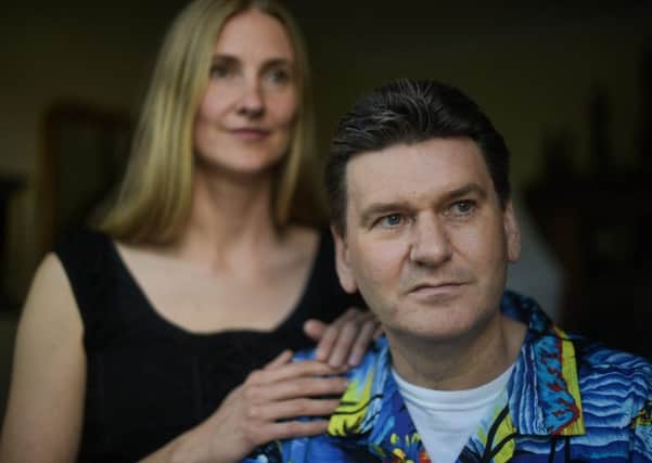 Brian Keeley, 52, is pictured with his wife Bibo, 40, at their home in Aberdeen, Scotland. Picture: Contributed