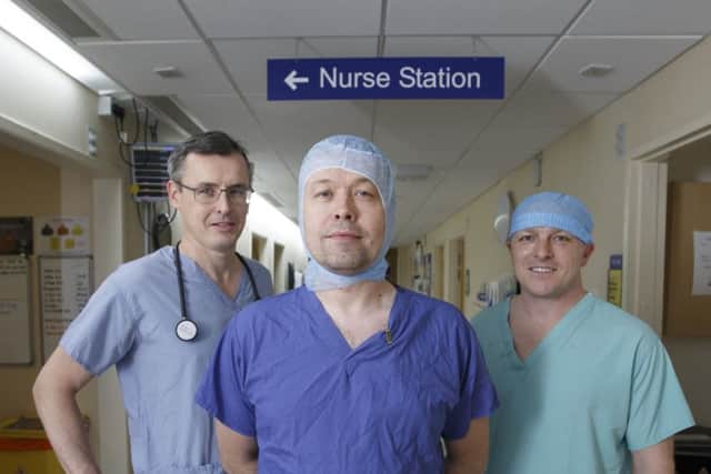 The Medical team at Golden Jubilee Hospital, L to R : Mark Petrie (consultant cardiologist), Phil Curry (transplant surgeon) and Alan Palmer (perfusionist) in their scrubs. Picture: Robert Perry